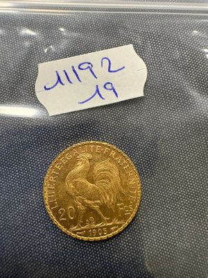 a close up of a coin in a plastic bag on a table