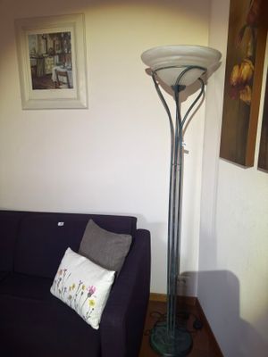 a couch and a lamp in the corner of a room