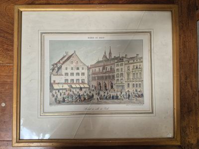 tableau encadré représentant une scène de rue dans une ville