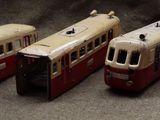 four toy trains sitting next to each other on a table
