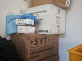 many boxes stacked on top of each other on the floor