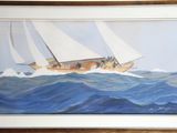 tableau représentant un voilier sur une mer agitée, dans un cadre en bois