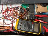 a yellow and black multimeter sitting in a box