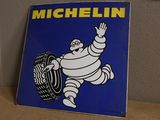 a michel tire sign on a shelf in a room