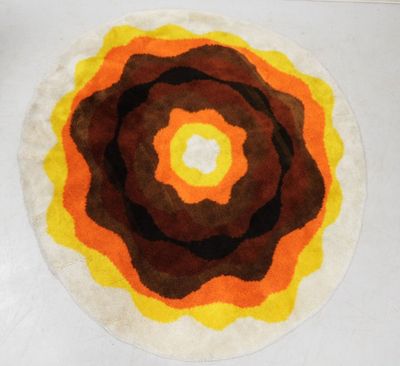 a rug with a circular design on it on the floor