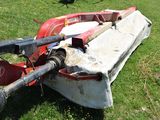 a boat that is sitting on the grass in the field