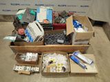 many boxes of assorted electronics on the floor