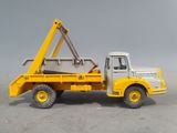 a toy truck with a crane on the back of it