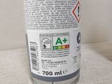 a close up of a bottle of liquid on a table