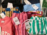 a pile of clothing that is on display in a store