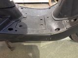 a scooter that is sitting in the garage