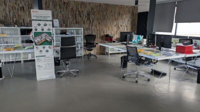 a room with a lot of desks and chairs in it