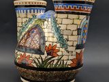 two vases sitting side by side on a table
