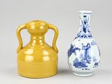 two vases sitting next to each other on a table