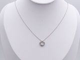 silver plated necklace with an open circle pendant on a white mannequin