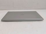 a laptop that is sitting on a white table