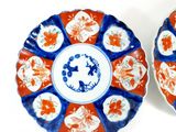 two plates that are decorated with flowers on them