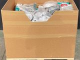 a cardboard box with a bunch of items inside of it