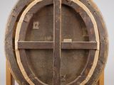 an old wooden barrel with a cross on top of it
