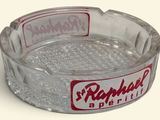 a glass ashtray with a red and white logo on it