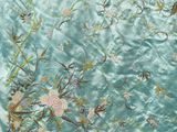 an image of a close up of a piece of fabric with flowers on it