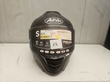an image of a helmet on a table with a tag on it