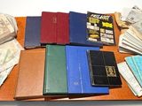 a lot of money on a table with a lot of books