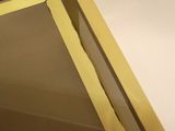 a close up of a mirror in a bathroom with a light on