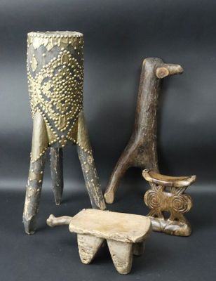 three pieces of art that are sitting on a table