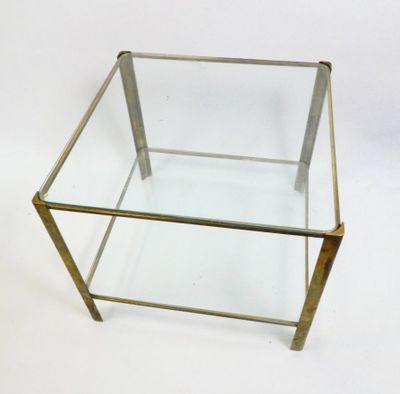 brass and glass coffee table with a glass top