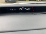 a car dashboard with a digital display on it