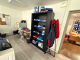 a room with a bookcase and a desk in it