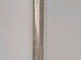 a metal tube that is sitting on a table
