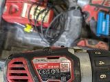 an image of a cordless drill and two batteries in a case