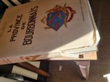 a stack of books sitting on top of a chair
