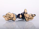 pair of blue and gold earrings with a dog design on them