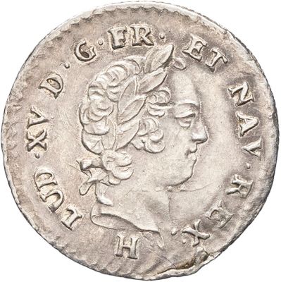 une pièce d'argent portant une tête de femme