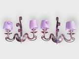 a set of four purple glass and metal wall lights
