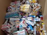 a cardboard box filled with lots of different types of food