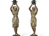 pair of bronze figurines of egyptian women with hats on their heads