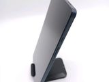 a close up of a cell phone on a stand