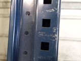 a close up of a piece of metal that has holes in it