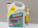 a bottle of groundup next to a toothbrush on a table