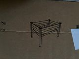 a cardboard box with a drawing of a chair on it
