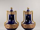 pair of blue and gold vases with handles and handles