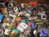 a box full of key chains and other items in it
