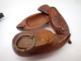 two wooden shoes that are sitting on a table