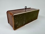 a small wooden box with a handle on top of it
