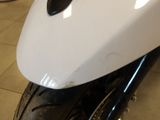 a close up of a motorcycle with a black and white seat