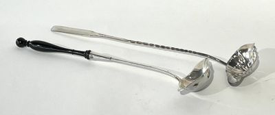 two spoons and a ladle on a white surface